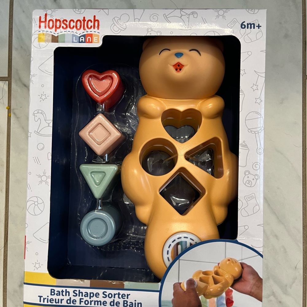 Hopscotch Lane Bath Shape Sorter - Tan Otter with Pastel Shapes